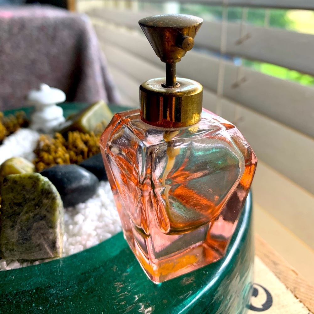 Antique pink perfume bottle